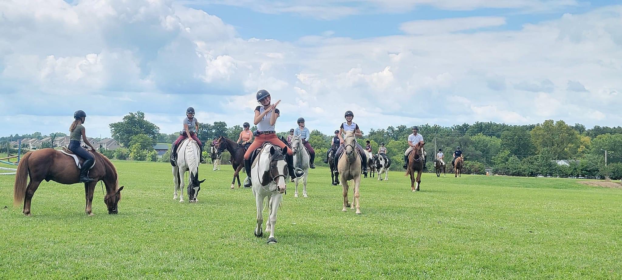 Riders return from their group jumping out in the open at the Focus on Jumping clinic