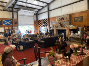 Clinic riders learn more about foxhunting and meet the foxhounds in Camargo's clubhouse.